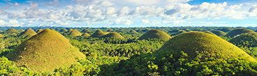 Chocolate Hills under blue sky in the Philippines.
